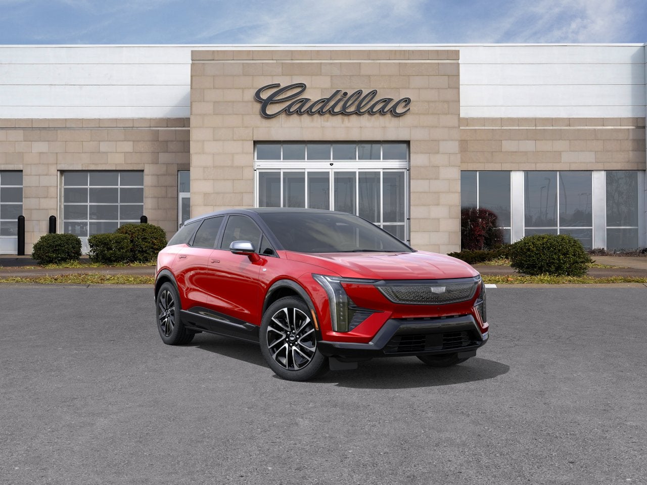 2026 Cadillac OPTIQ Sport in Radiant Red Tintcoat — front three-quarter view
