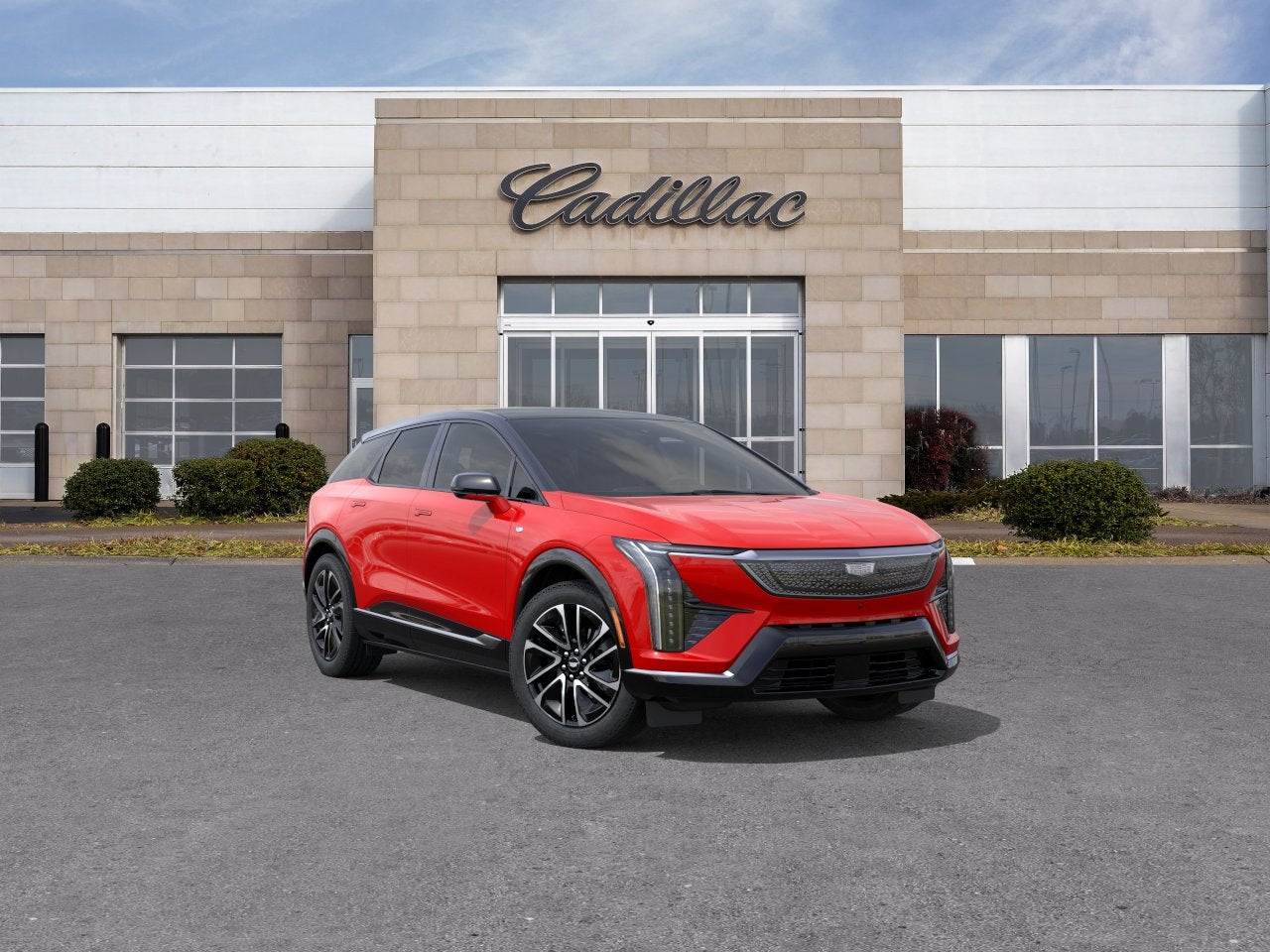 2026 Cadillac OPTIQ Premium Sport in Monarch Orange — front three-quarter view