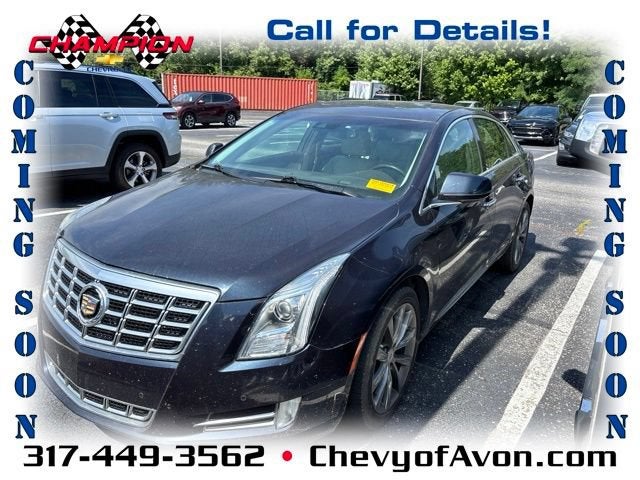 2013 Cadillac XTS Luxury in Sapphire Blue Metallic — front three-quarter view